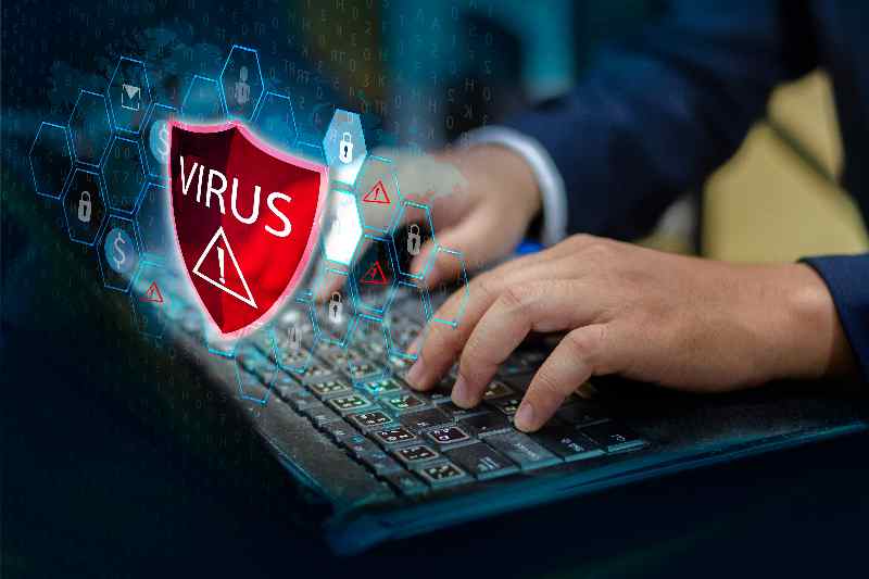 Press enter button on the keyboard computer Protective shield virus red Exclamation Warning Caution Computer in dark with word virus - Startlap