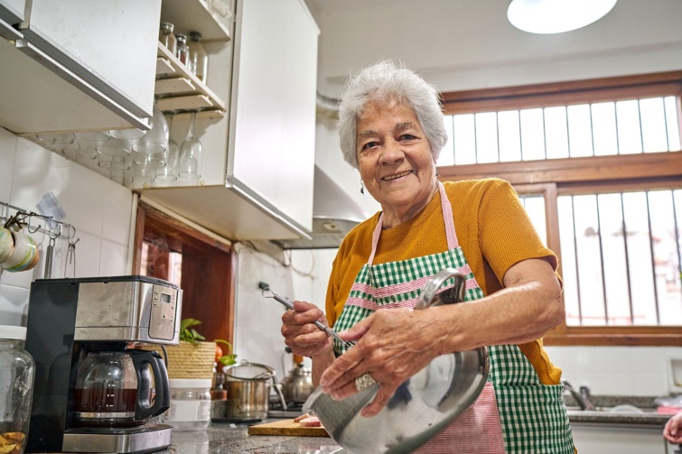 Candid portrait of grandma cooking Startlap Vásárlás